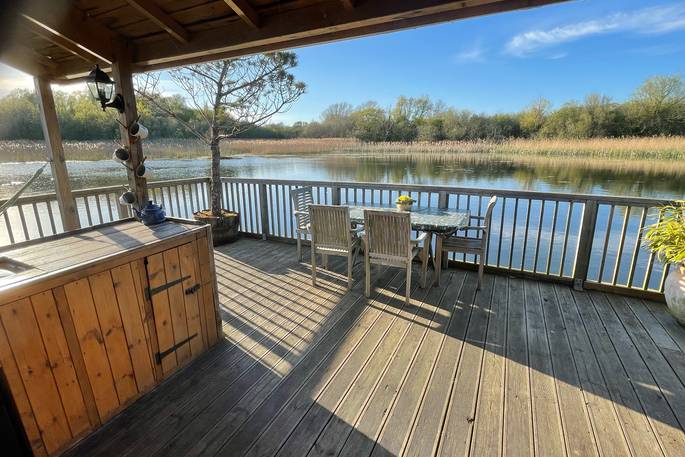 Decking with outdoor dining table with seating for four